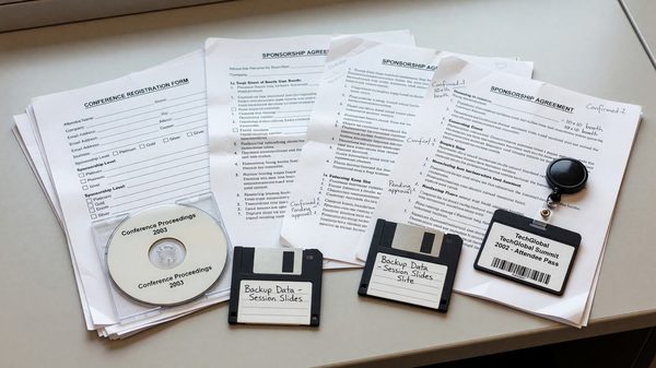 Archived conference registration and sponsorship documents from an early-2000s international technology conference